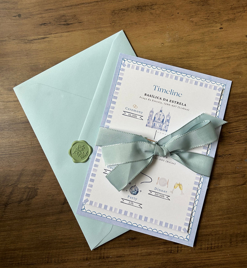 Wedding invitation card with ribbon, envelope and wax seal.
